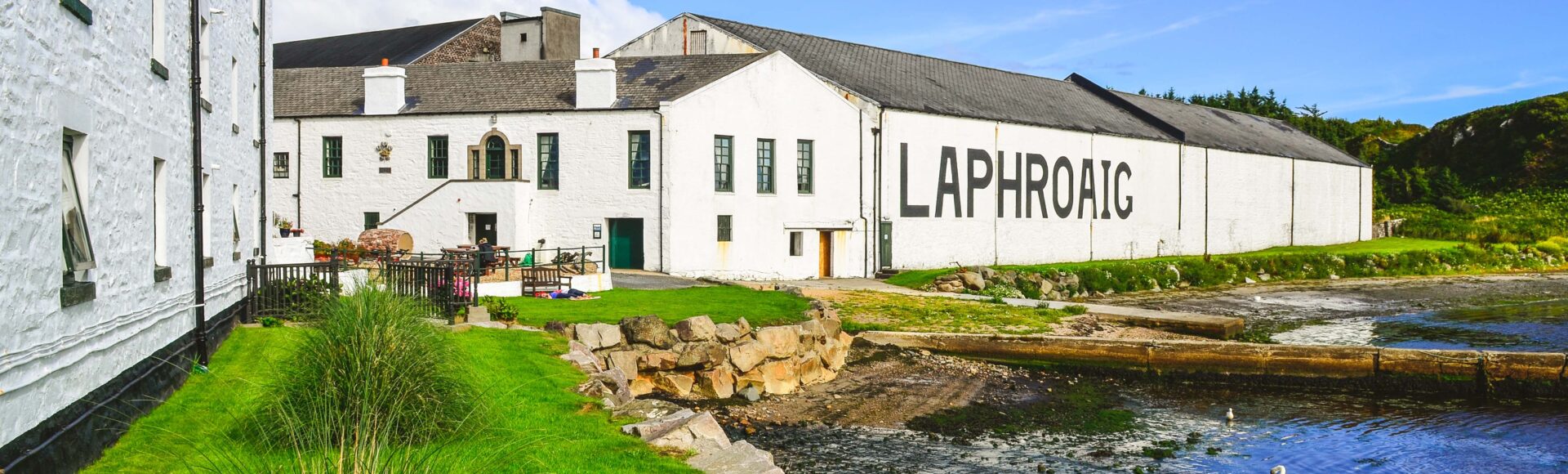 https://www.hebrideanadventures.co.uk/wp-content/uploads/2024/10/Laphroig-distillery-Islay-scaled-e1728398287503.jpg